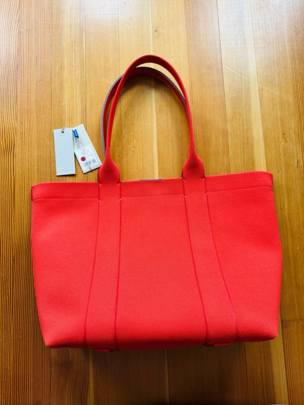 Never used sold out Rothy’s “The Essential Tote” in Bright Poppy